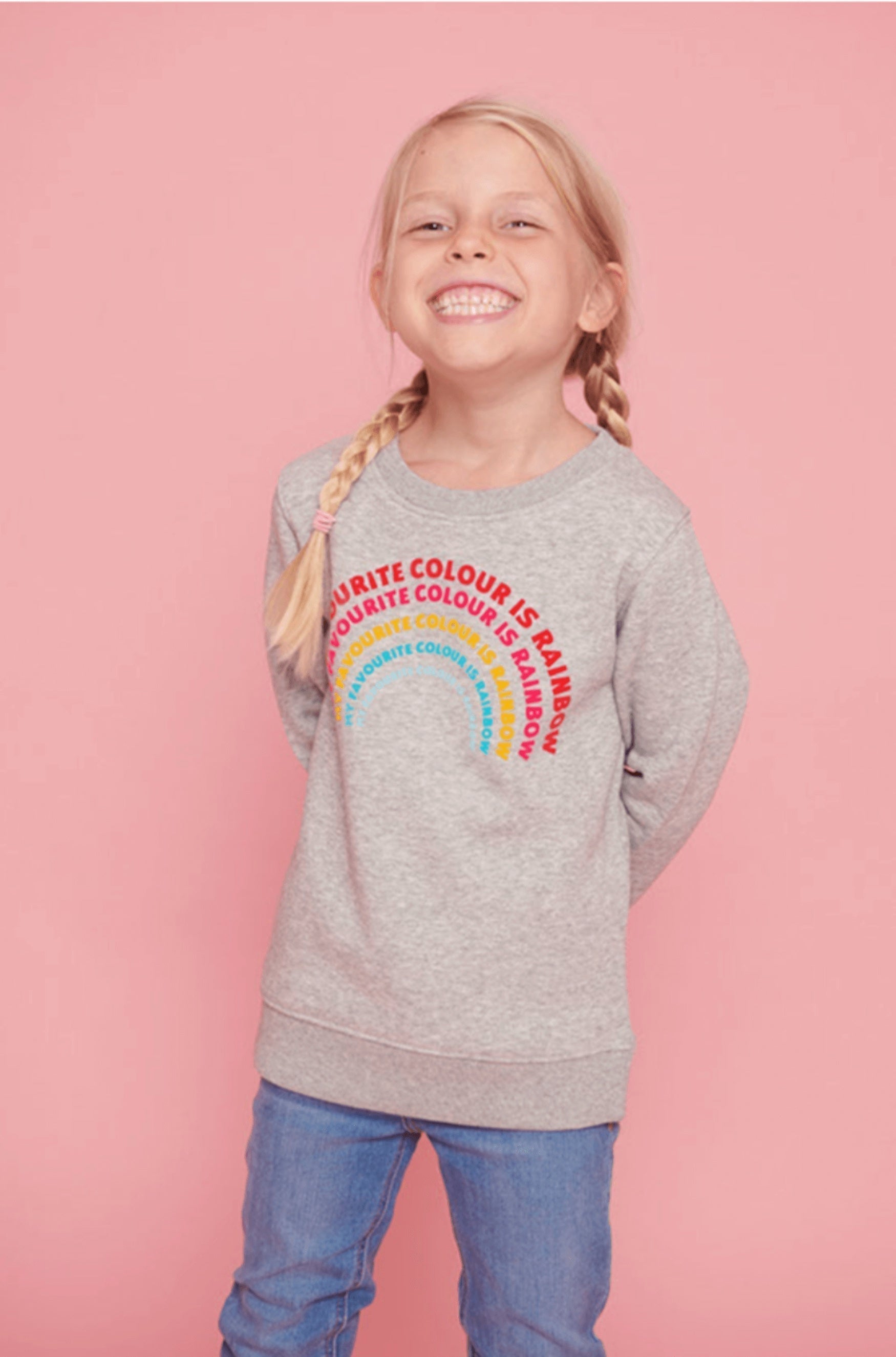 Child wearing a sweatshirt with My Favourite Colour is Rainbow on it.