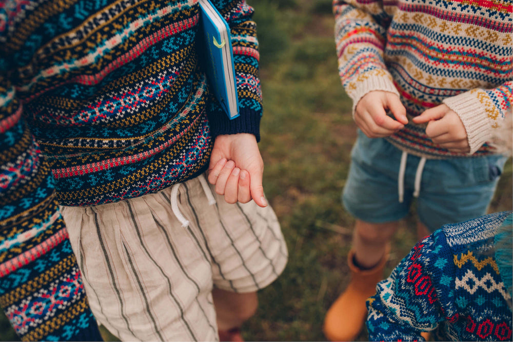 The-Faraway-Gang-children-wearing-preloved-knitted-jumpers