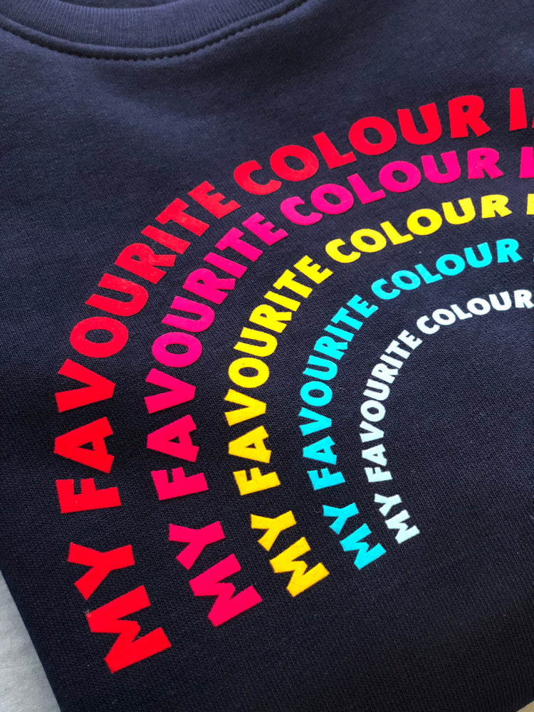 a 'Rainbow' Sweatshirt by The Faraway Gang with a rainbow on it.