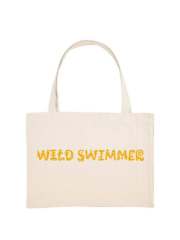 Natural colour shopping tote with wild swimmer printed in yellow.