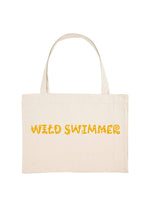 Natural colour shopping tote with wild swimmer printed in yellow.