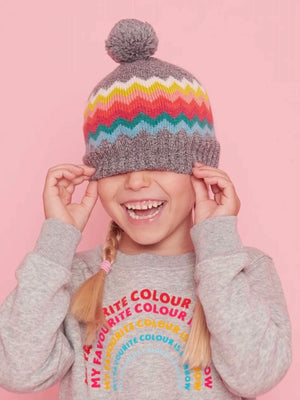 Young girl wearing the grey navigator hat.