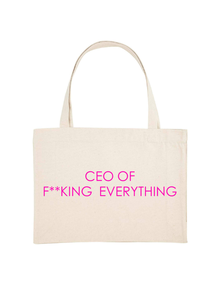 The Faraway Gang shopping tote bag with a slogan printed in neon pink.