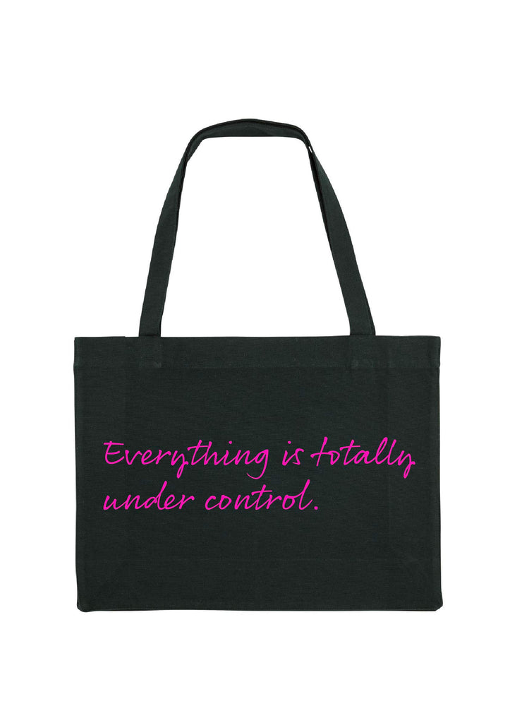 Black colour shopping tote with Everything is totally fine printed on it in neon pink.