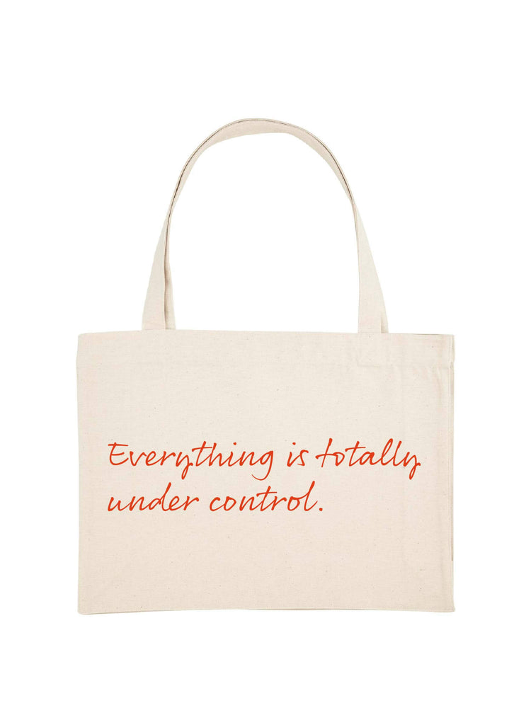 Natural colour shopping tote with Everything is totally fine printed on it in orange.