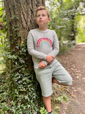 a 'Rainbow' Sweatshirt by The Faraway Gang with a rainbow on it.