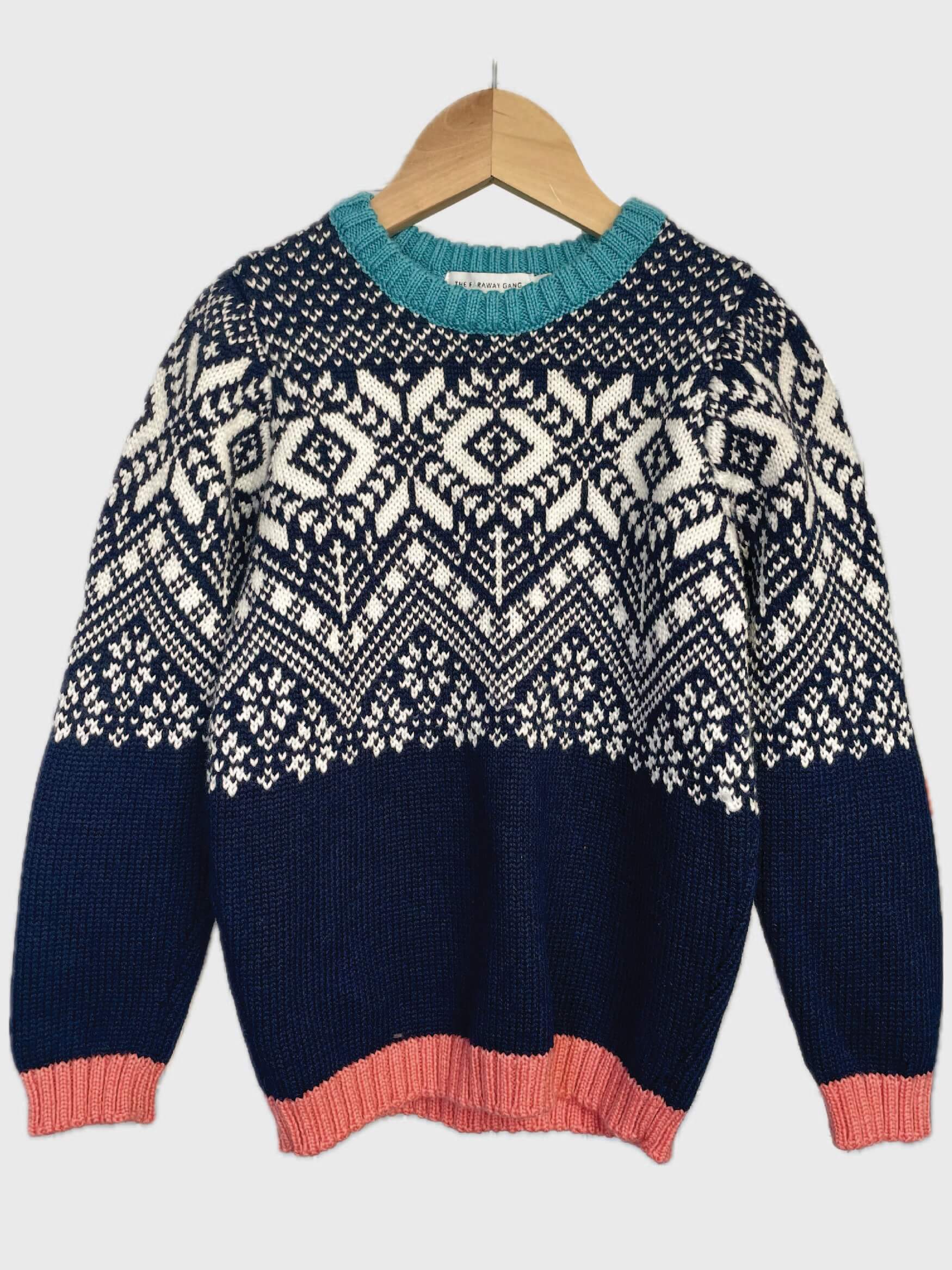 The Storyteller Jumper preloved on a hanger.